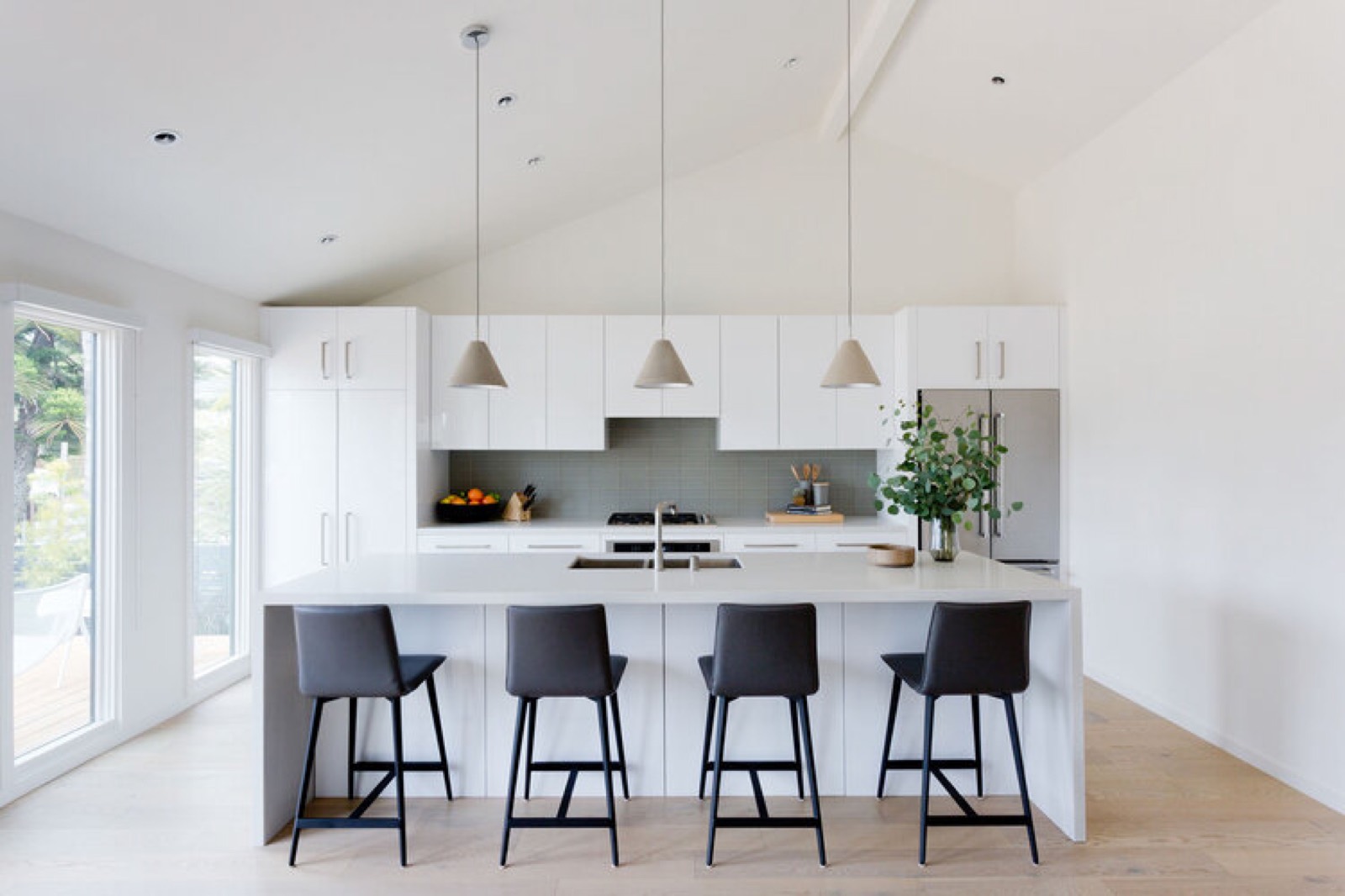 Bright completed interior with clean plaster walls and oak floors.